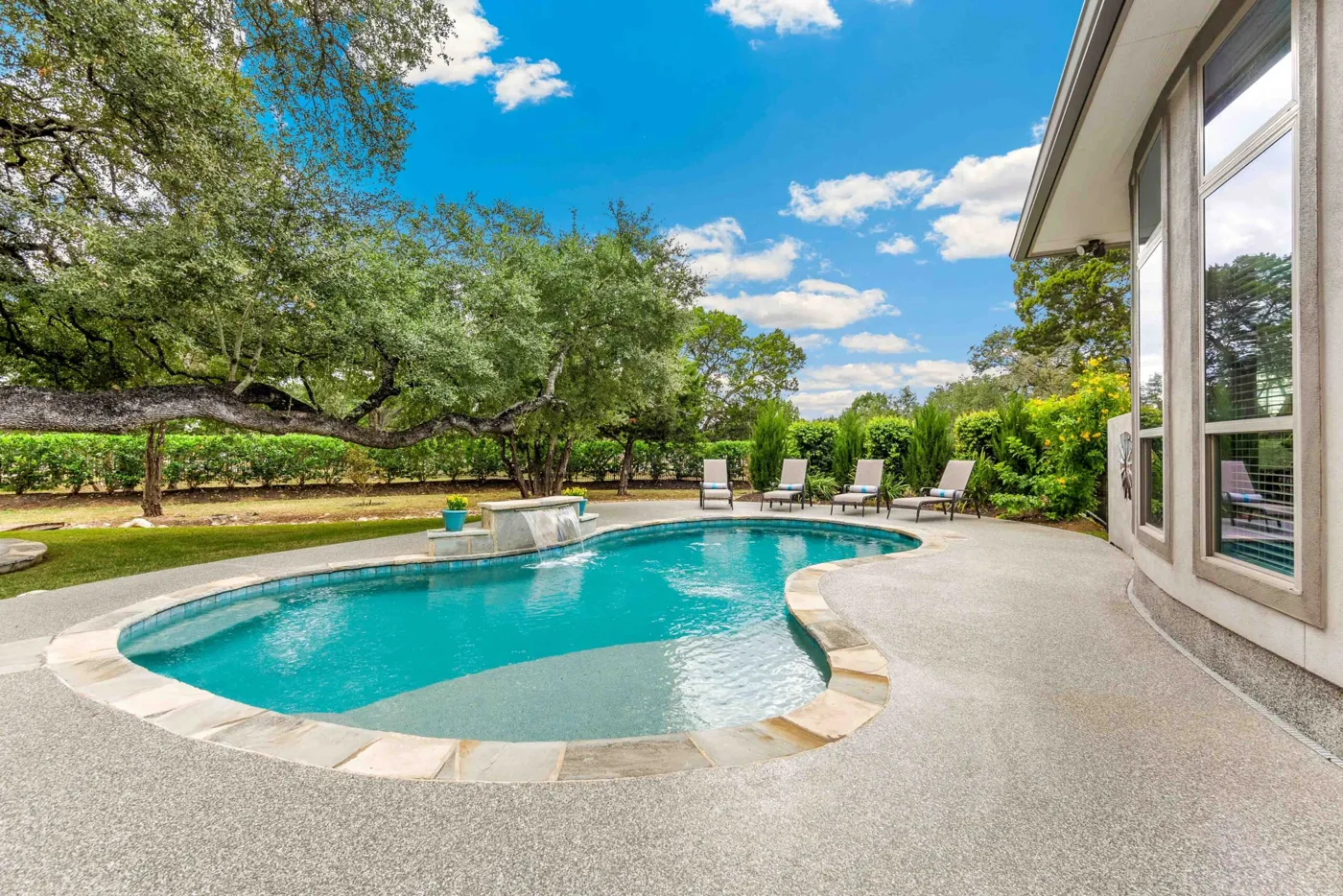 A sparkling backyard pool maintained by Whittier Village Pools